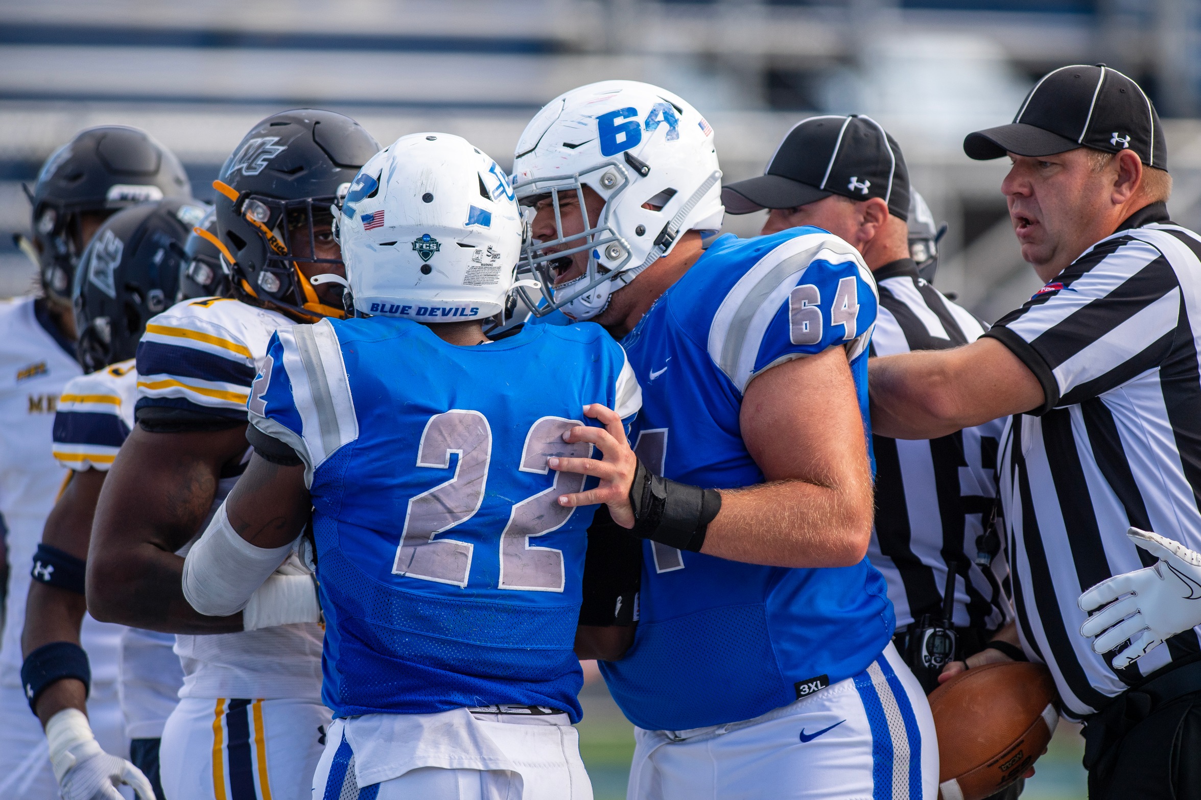 Nas Smith (left) rushed for a career-best 218 yards behind Craig Wood (right) and the offensive line on Saturday to win the NEC rushing crown. (Photo: Steve McLaughlin)