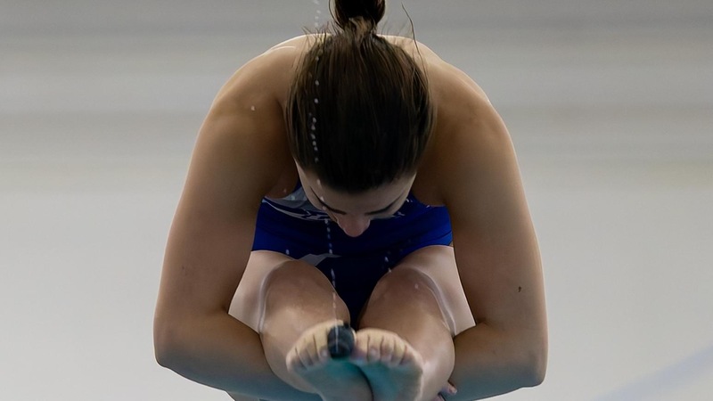Kaitlyn Carroll won gold on the 3-meter board as she led six Blue Devil divers to a 93-point effort on Wednesday evening on the first day of the NEC Swimming and Diving Championship. (Photo: Brian Fisher)